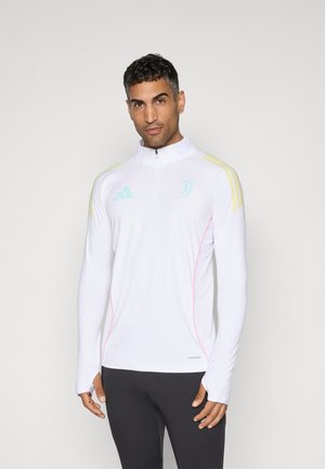 White long-sleeve athletic top with a quarter-zip, featuring mint green and yellow accents, smooth texture, and a slim fit design.