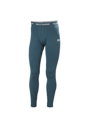 Leistungsleggings in einem dunklen Jadegrün, aus einem dehnbaren, strukturierten Stoff, mit einem markierten Bund und einer engen Passform.