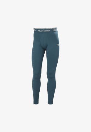 Leistungsleggings in einem dunklen Jadegrün, aus einem dehnbaren, strukturierten Stoff, mit einem markierten Bund und einer engen Passform.