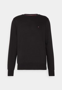 Felpa nera a maniche lunghe con scollo rotondo, dotata di un piccolo logo rettangolare rosso, bianco e blu sulla parte superiore sinistra del petto.