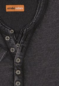 Black textured henley shirt with a V-neck, featuring five grey button fastenings and an orange brand tag with "emilio adani" on the collar.