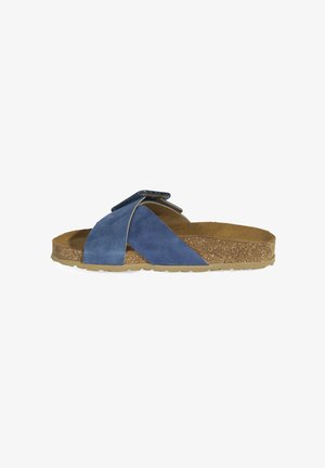 Blue suede slide sandal with a cork sole, featuring cross straps and a textured finish on the upper. Adjustable strap for fit.