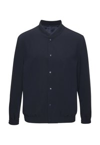 Navy blue jacket with a stand collar, snap buttons, elasticized waistband, and side pockets; smooth texture and minimal design.