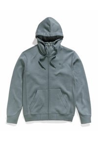 Felpa con zip in morbido tessuto teal tenue. Presenta una tasca frontale, lacci e accenti di cucitura a contrasto. Texture liscia in tutto il capo.