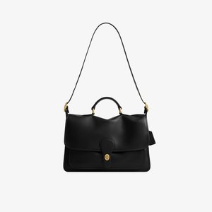 Black leather satchel bag with top handle, long adjustable shoulder strap, and gold-tone turn-lock closure on front flap.