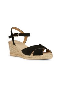 Sandalo wedge in suede nero con design incrociato, cinturino alla caviglia e suola in corda di juta beige. Dotato di una fibbia regolabile per una calzata sicura.