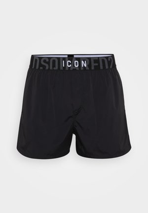 Costumi da bagno neri con fascia elastica in vita, caratterizzati da un logo a contrasto. Realizzati in materiale leggero, progettati per comfort e libertà di movimento.