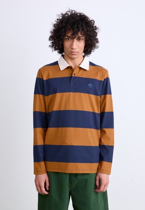 Langarm rugbyshirt met afwisselend marineblauw en mosterdgeel gestreept, voorzien van een witte kraag en een klein logo op de borst.