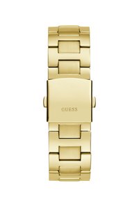 Gold stainless steel watch with a square face and linked band. The brand name "GUESS" is engraved on the case. Smooth and polished texture.