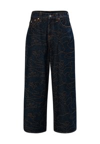 Czarne szerokie spodnie z denimu z abstrakcyjnym wzorem pomarańczowych linii, pięcioma kieszeniami i metalowym guzikiem przy pasku.