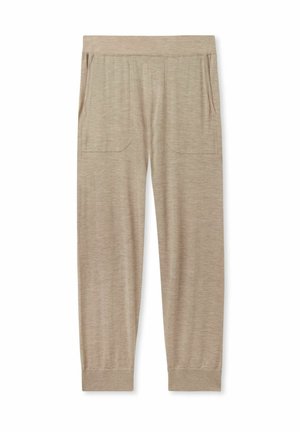 Beige Jogginghosen aus weichem Stoff, ausgestattet mit einem elastischen Bund, zwei Seitentaschen und schmal zulaufenden Bündchen an den Knöcheln.