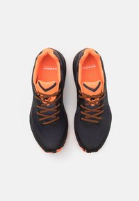 Black and orange athletic shoes with a textured mesh upper, contrasting laces, padded collar, and rubber outsole.