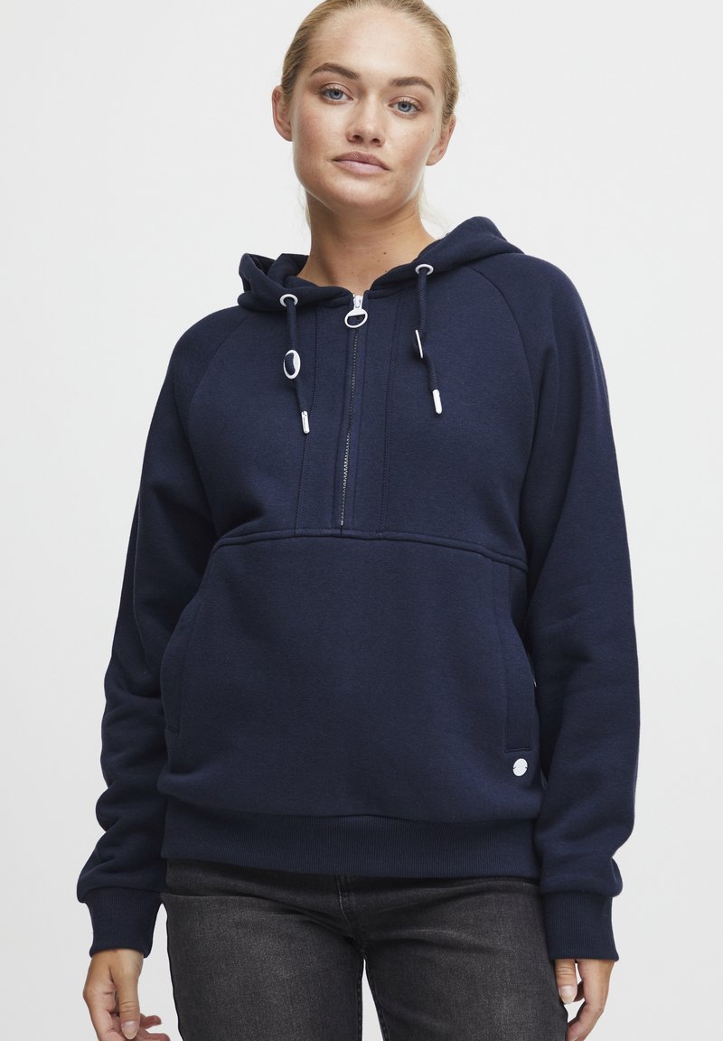 Navy blue zip-up hoodie made of soft fabric, featuring a kangaroo pocket, adjustable drawstrings, and ribbed cuffs.