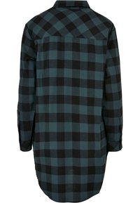 Robe-chemise à manches longues avec un motif à carreaux vert foncé et noir, vue de dos avec un col pointu et des poignets boutonnés.