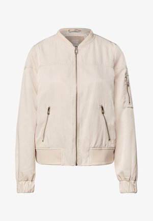 Bomber jacket beige chiaro, realizzato in tessuto liscio. Caratterizzato da una cerniera frontale, due tasche laterali con zip e polsini a costine. Design minimalista, senza motivi.