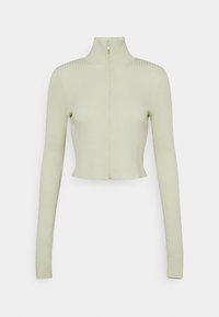 Ljusgrön ribbad stickad kort jumper med långa ärmar och hög halsdragkedja fram.