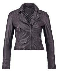 Veste de motard pour femme en cuir noir avec fermetures éclair, poche poitrine zippée, poche à rabat et doublure en tissu à pois.