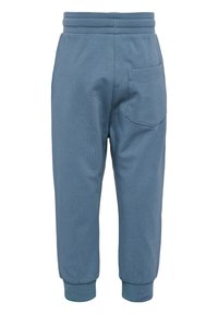 Blå bomullsoveraller med en åtsittande midja, ribbade manschetter och en enda bakficka. Mjuk textur, avslappnad design och enkel sömnad.