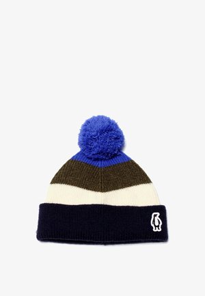 Strickmütze mit blauen, grünen und cremefarbenen Streifen, gekrönt mit einem blauen Pompon. Verfügt über einen gefalteten navyfarbenen Saum mit einem weißen Pinguin-Logo.