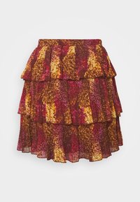 Jupe à volants dans des nuances de bourgogne, or et rose. Fabriquée en tissu léger avec une texture plissée et des bords festonnés. Taille élastique.