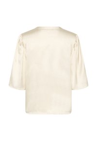 Blusa in satin crema con maniche corte a palloncino e scollatura rotonda. Tessuto liscio, vestibilità ampia e design semplice e minimalista.