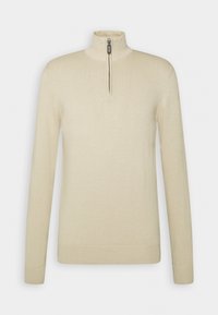 Béžový dlouhý svetr s dlouhými rukávy, vysokým límcem a zipem u krku. Vyroben z měkké pletené látky, s žebrovanými lemy na rukávech a spodním okraji.