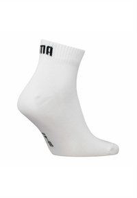 White ankle sock with ribbed cuff, black brand text near the top, and size information printed in black on the sole side.