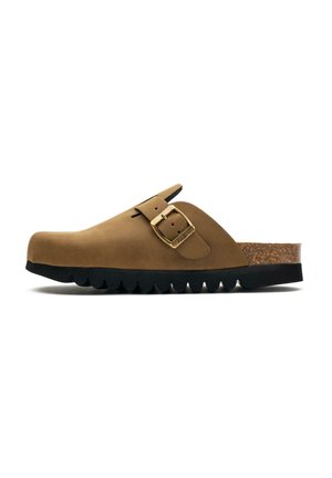 Brown suede clog with a curved shape, buckle detail, cork footbed, and a thick black rubber sole featuring scalloped edges.
