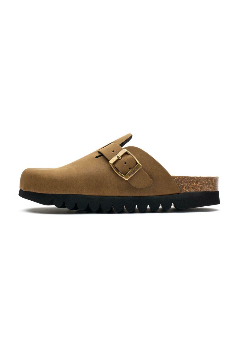 Brown suede clog with a curved shape, buckle detail, cork footbed, and a thick black rubber sole featuring scalloped edges.