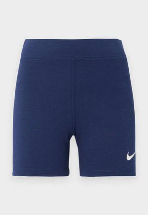 Tumed sinine sportlikud lühikesed püksid venivast materjalist, millel on lai vöökoht ja valge Nike logo vasakul alakul.