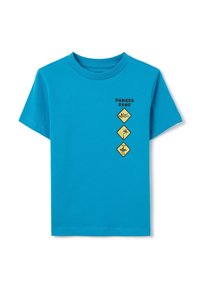 Camiseta de algodón azul con cuello redondo. El gráfico frontal incluye cuatro señales de advertencia amarillas con íconos negros y el texto "ZONA DE PELIGRO."