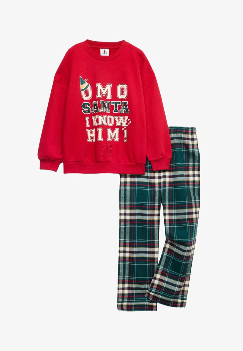 Sweatshirt rouge avec le motif "OMG SANTA I KNOW HIM!", associé à un pantalon à carreaux verts avec des accents blancs, jaunes et rouges. Tissu doux.