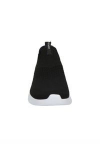 Svart slip-on sko laget av strikket stoff, med en teksturert overdel, et pull-tab, og en hvit gummisåle.