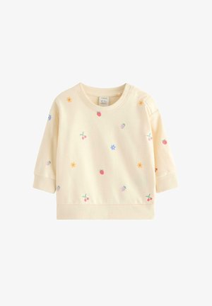 Ljusgul sweatshirt med långa ärmar, prydd med färgglad broderi av frukter och blommor. Mjuk textur med ribbade ärmmuddar och nederkant.