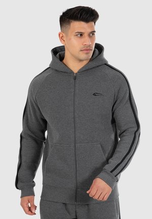 Grijze rits-hoodie met contrasterende zwarte zijstrepen, voorzakken en een capuchon met trekkoord. Zachte, gestructureerde stof voor comfort.