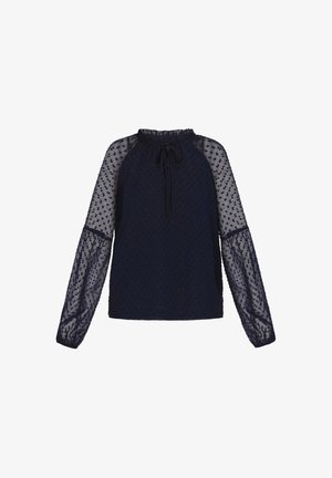 Tumed sinine topp, millel on tekstuuriga laternaga kohtadega disain, läbipaistvad pikad varrukad ja kogutud kaelus, millel on side.