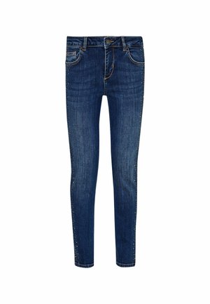 Jeans skinny din denim albastru închis cu o textură fină și detalii decorative din blaști pe cusăturile laterale. Cousătură întunecată și buzunare frontale vizibile.