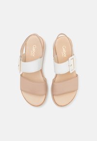 Beige and white Gabor sandals with two wide straps and a buckle detail. Smooth leather material with a flat sole.