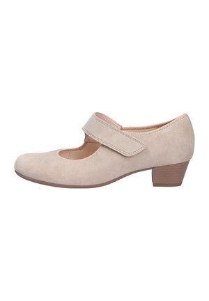 Beige suede Mary Jane shoes with a round toe, adjustable Velcro strap, and a low heel. Smooth texture and minimal stitching details.