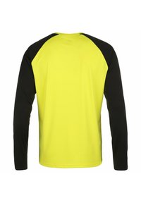 Langärmliges Shirt mit einem leuchtend gelben Oberteil und schwarzen Raglanärmlen. Hergestellt aus glattem, leichtem Material mit Rundhalsausschnitt.