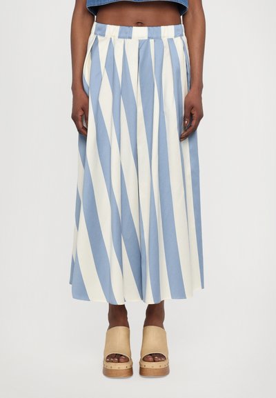 Blue and white striped maxi skirt with pleats, featuring a wide waistband. Paired with tan platform clogs.