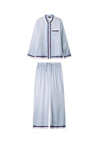 Light blue pajama set featuring a button-up top with a pocket, and loose pants with a drawstring. Trimmed in dark blue and white with a pattern.