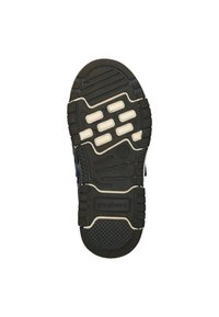 Semelle de chaussure en caoutchouc noir avec des accents blancs. Comprend des rainures pour l'adhérence et plusieurs coussinets surélevés. Les zones texturées améliorent la traction.