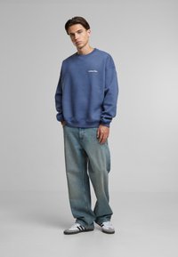Another Cotton Lab BAD IDEAS GOOD STORYS OVERSIZE - Bluză de molton - blue