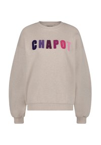 Felpa beige chiaro con la scritta “CHAPOT” in lettere feltro di colore gradient da viola a rosa. Presenta polsini e orlo a costine, vestibilità morbida e scollatura a girocollo.
