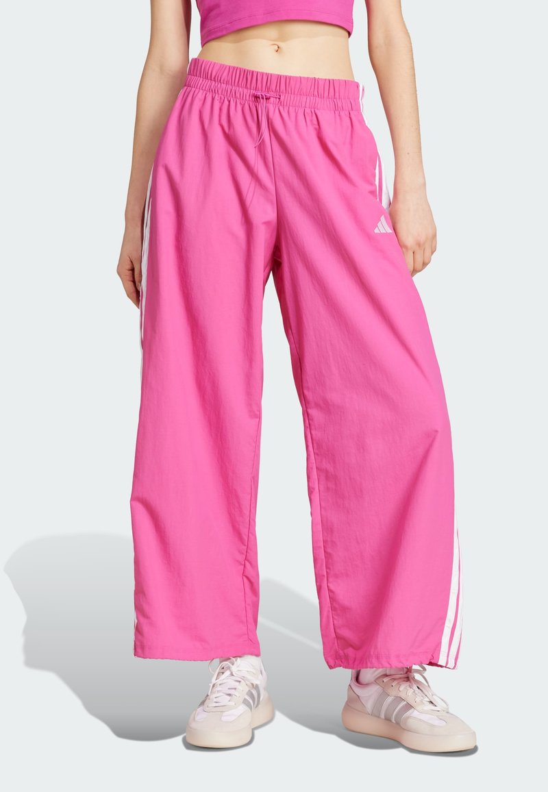 adidas Sportswear - ESSENTIALS STRIPES LIFESTYLE PARACHUTE - Tracksuit bottoms - semi lucid fuchsia white, Enlarge