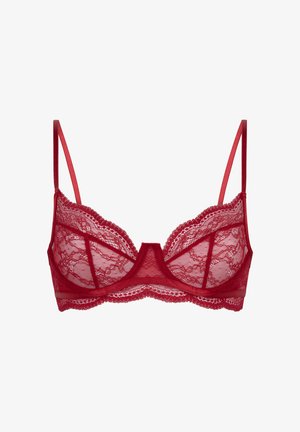 Soutien-gorge en dentelle rouge avec bonnets semi-transparents et bretelles satinées réglables. Présente des bords en dentelle festonnée et un panneau décoratif central.