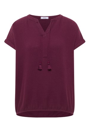 Short-sleeve, textured dark purple blouse with V-neck, decorative tassel ties, and elastic hem.