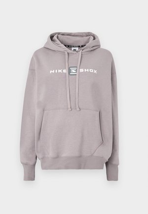 Világosszürke Nike Shox kapucnis pulóver kenguru zsebbel, húzózsinóros kapucnival és elöl nyomtatott logóval. Pamut keverék anyag, puha tapintású.