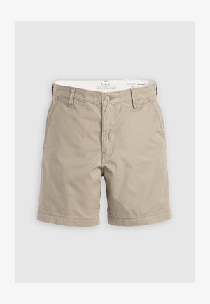 Bežne bež hlače iz bombaža, z gumbom za zapiranje, stranskimi žepi in ravnim krojem. Gladka tekstura z udobnim prileganjem.